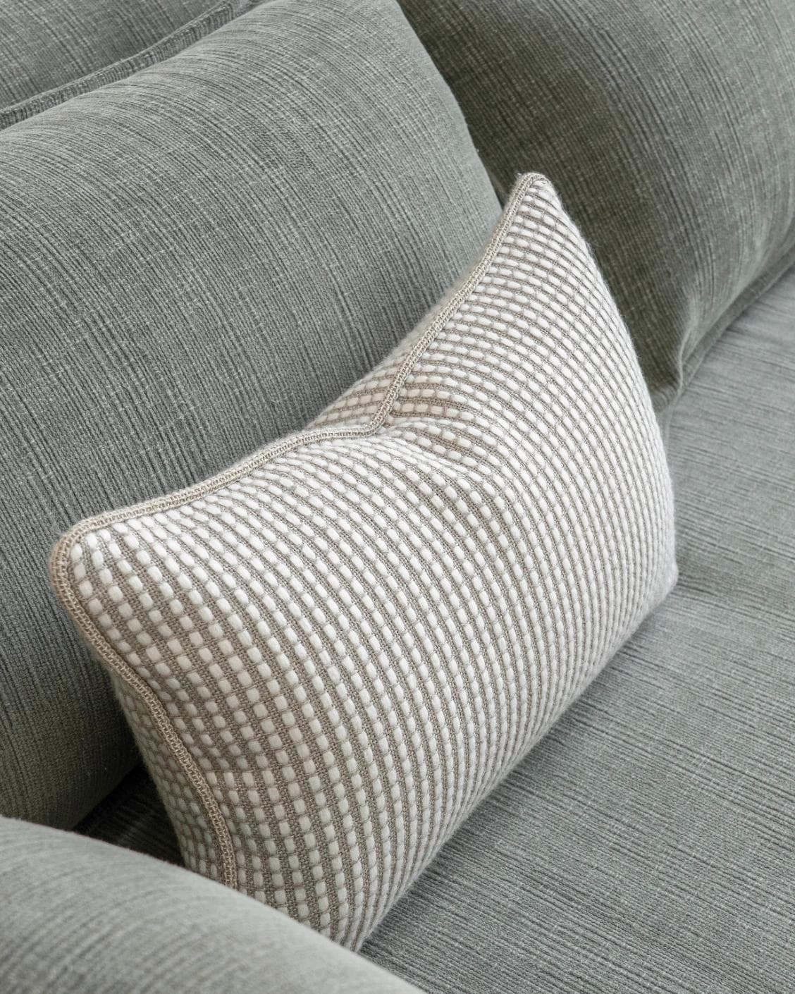 Shea Laurent II cushion in beige, shown in a lifestyle top view as image 5
