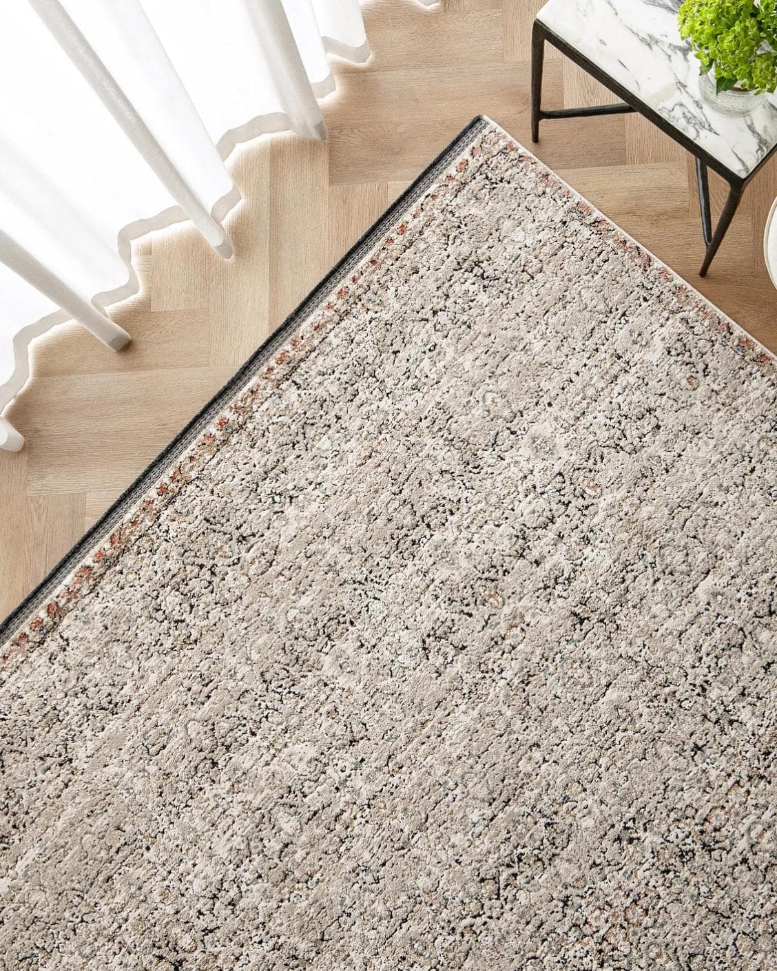 Sheldon Dune carpet in beige, shown in a lifestyle top view as image 2