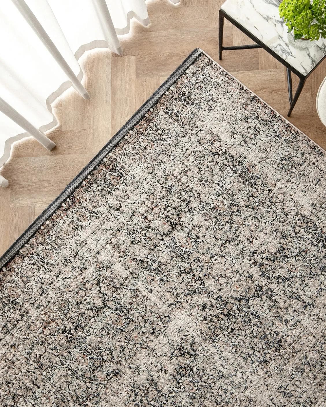 Sheldon Ebony carpet in black and beige, shown in a lifestyle top view as image 2