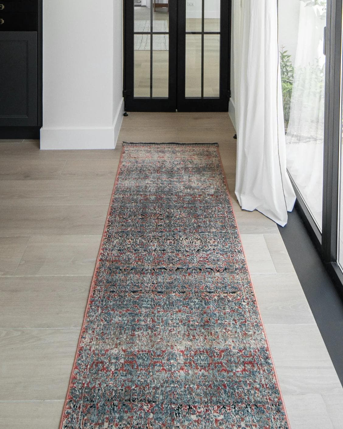 Sheldon Rosso Runners carpet in red and rust, shown in a lifestyle front view