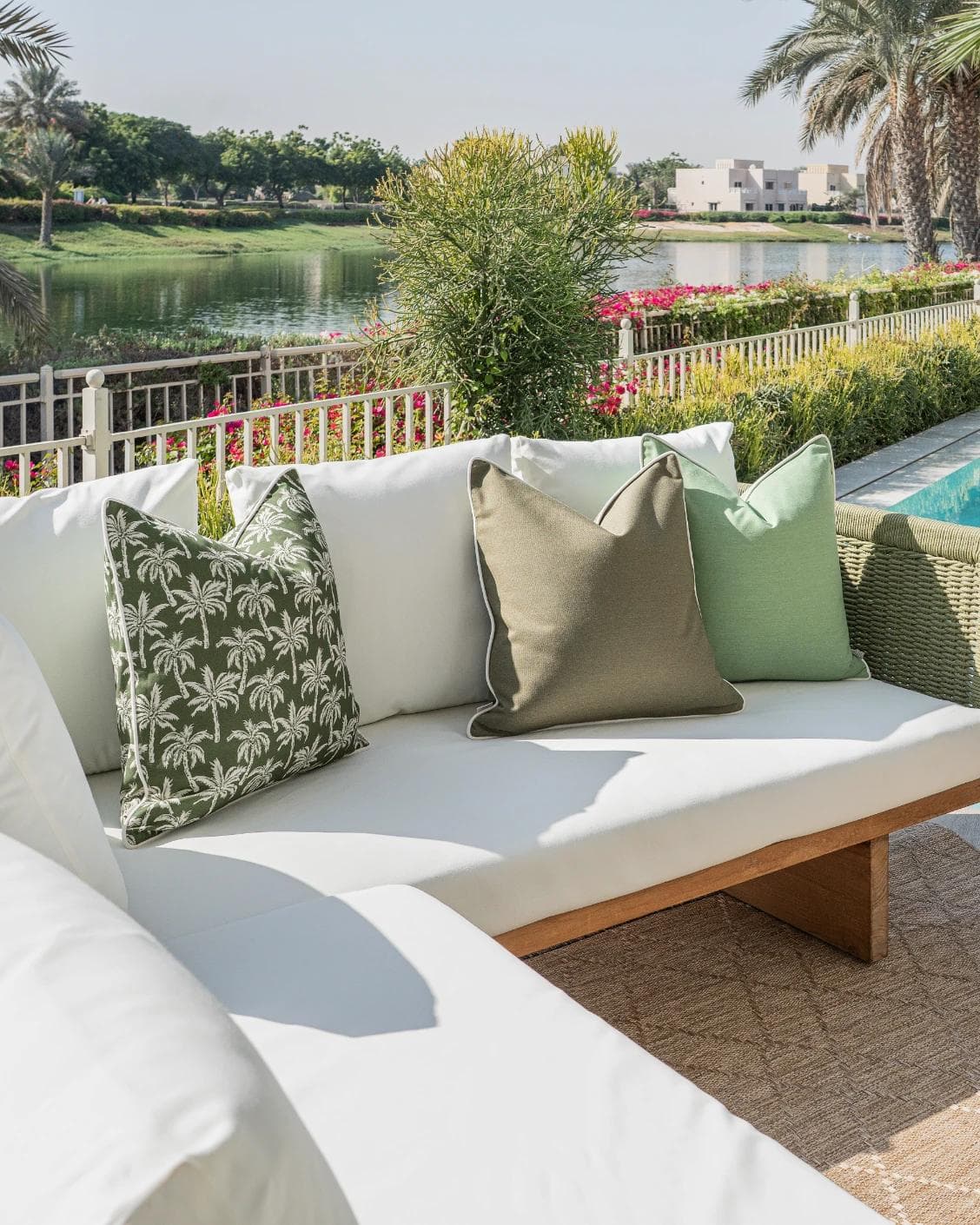 Shikha Bundle cushion in green, shown in a lifestyle left view as image 2