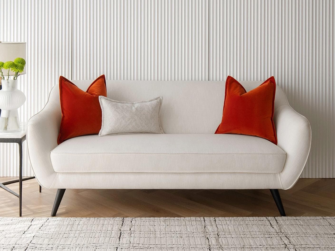 Jayme Bundle cushion in white and orange, shown in a lifestyle front view as image 4