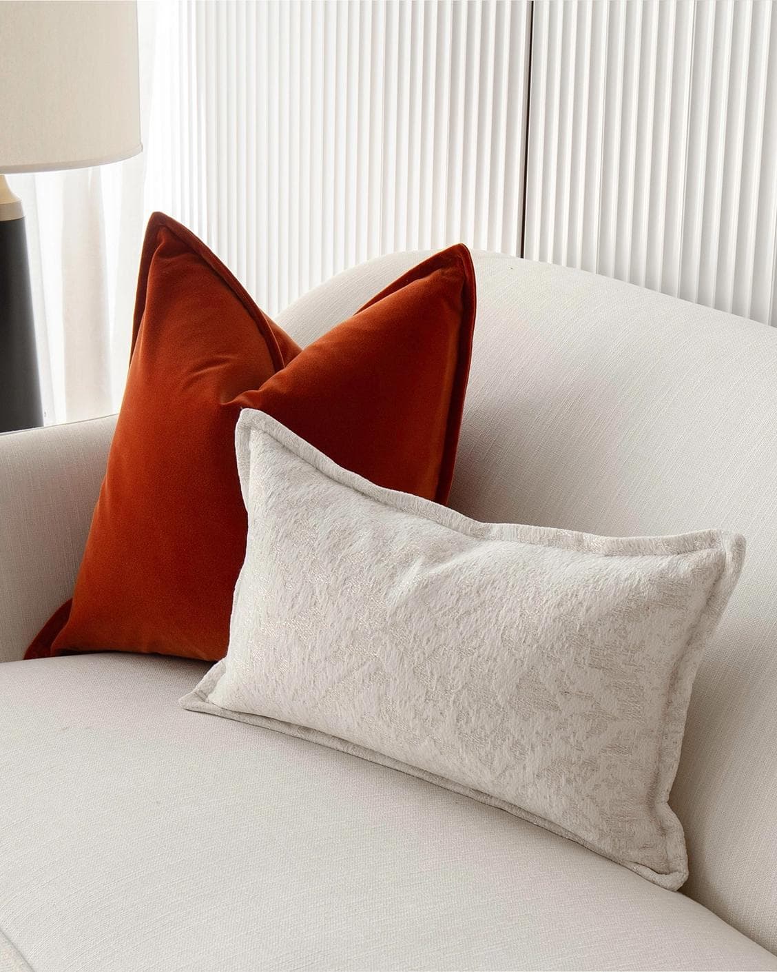 Jayme Bundle cushion in white and orange, shown in a product right view as image 5