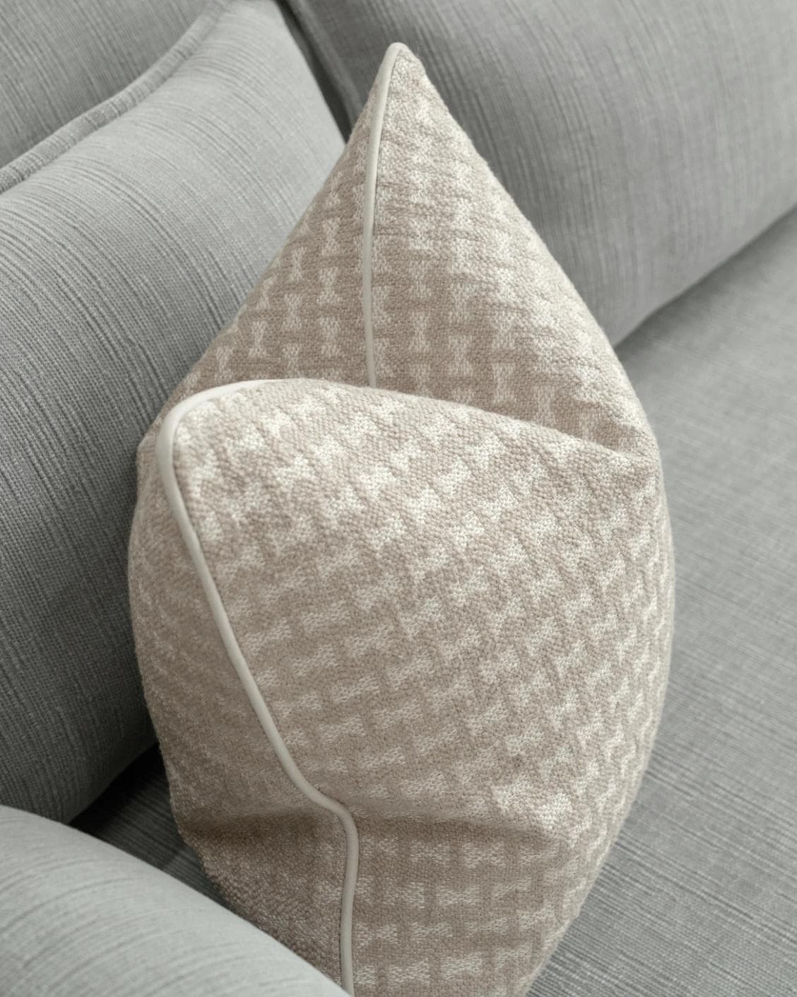 Sia Laurent cushion in ivory, shown in a lifestyle top view as image 5