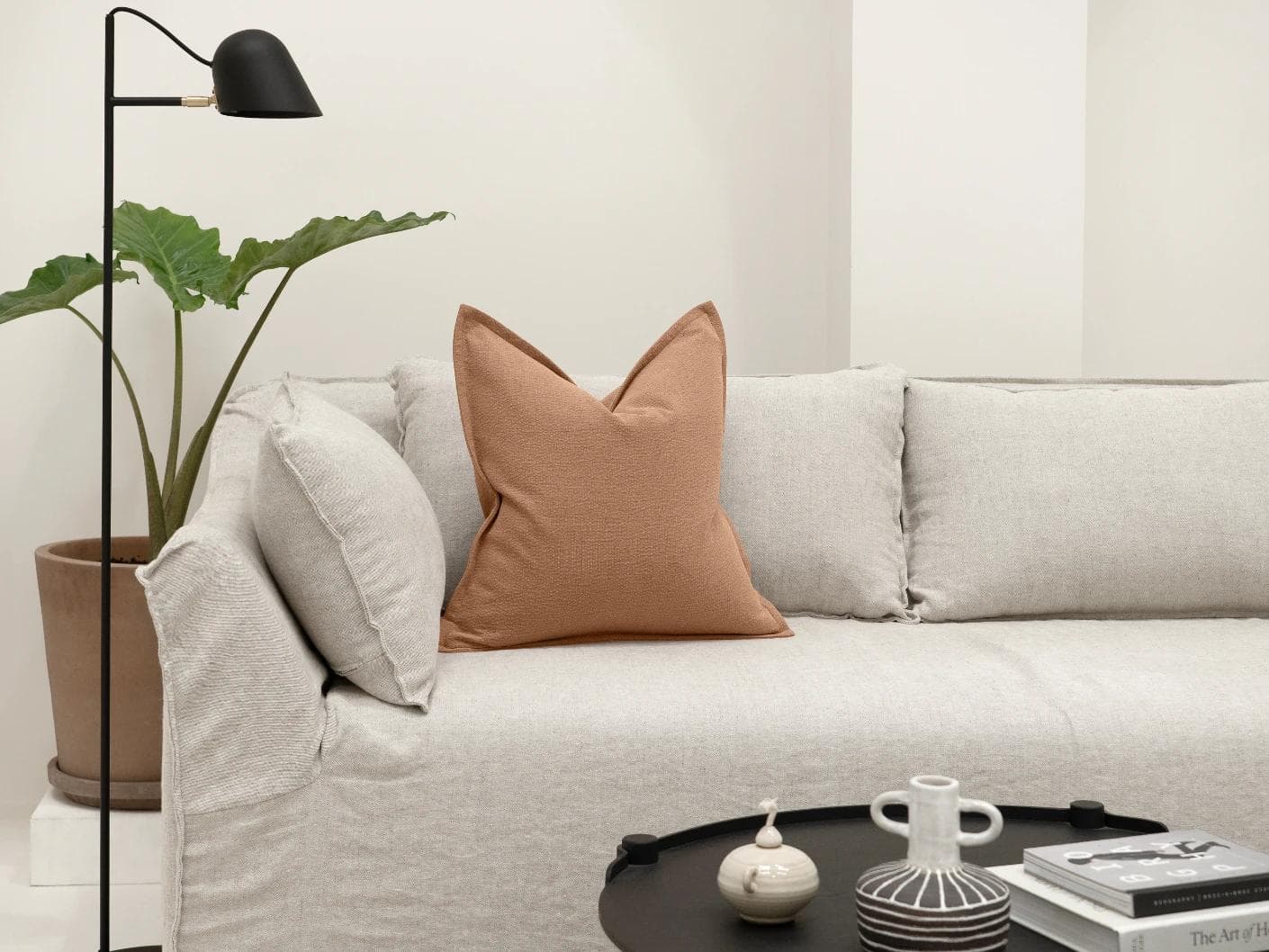 Siena Alecia cushion in orange, shown in a lifestyle front view as image 4