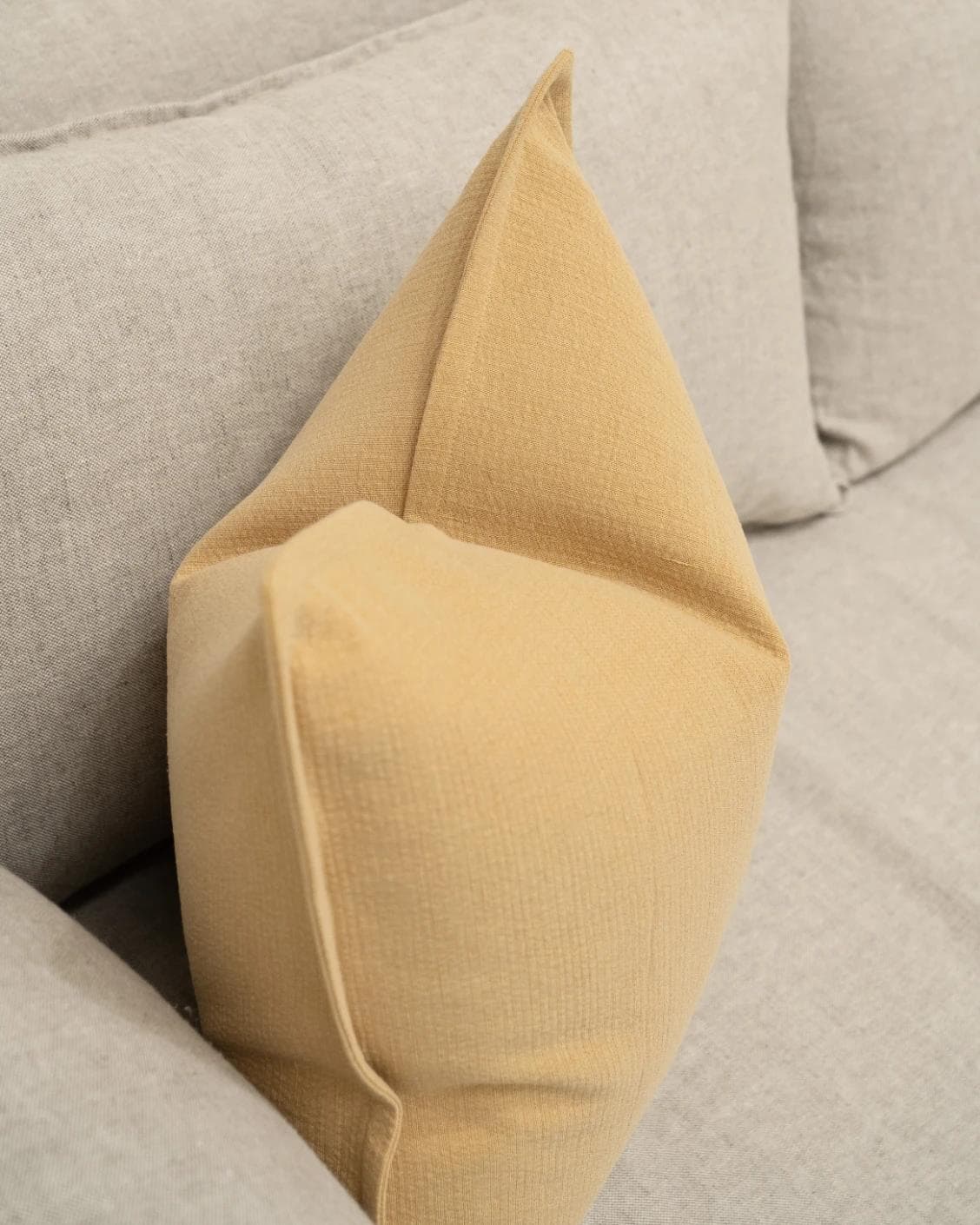 Siena Barrymore cushion in yellow, shown in a lifestyle top view as image 6