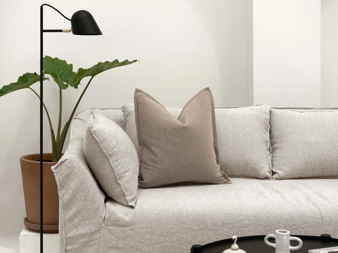 Siena Braun cushion in beige and grey, shown in a lifestyle front view as image 4