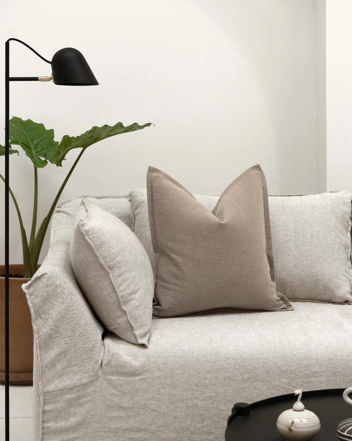 Siena Braun cushion in beige and grey, shown in a lifestyle front view as image 4