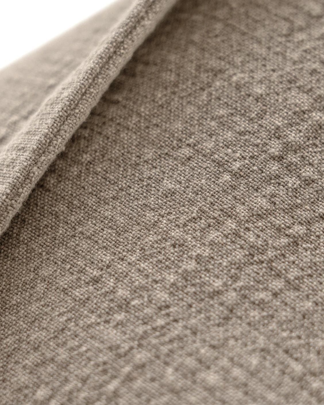 Siena Braun cushion in beige and grey, shown in a product close-up as image 7