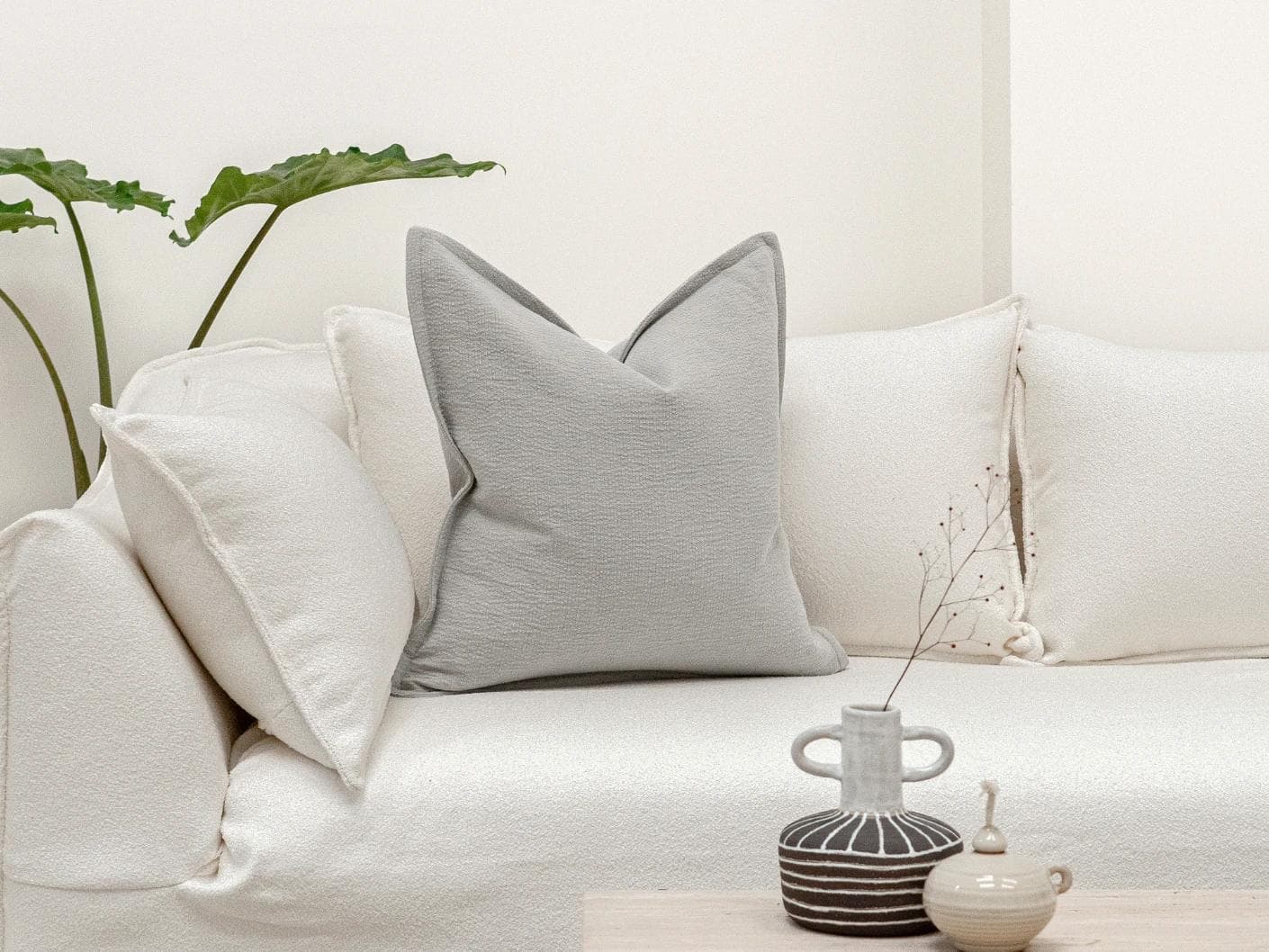 Siena Hodler cushion in grey, shown in a lifestyle front view as image 4