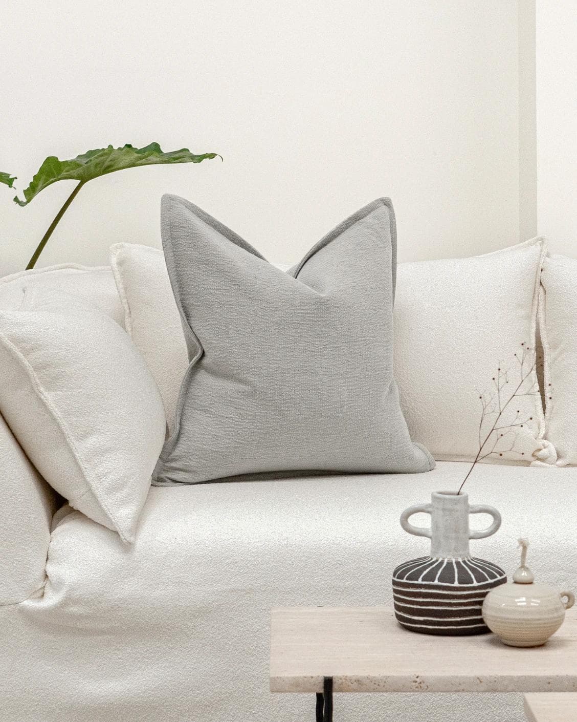 Siena Hodler cushion in grey, shown in a lifestyle front view as image 4