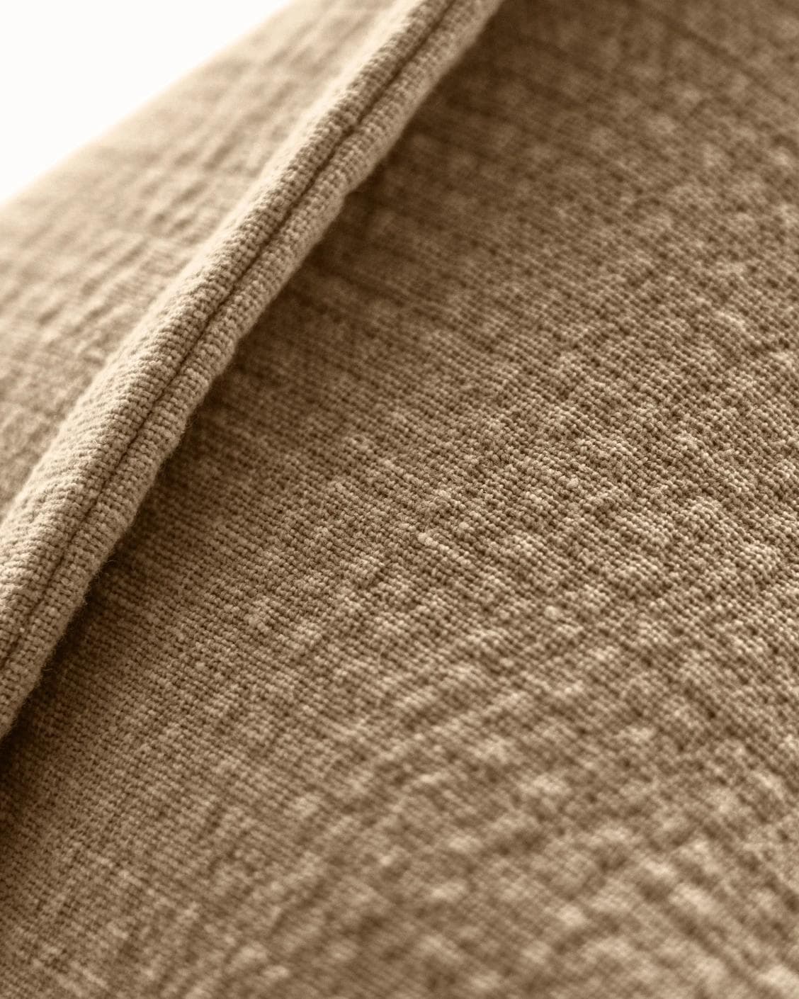 Siena Laurent cushion in brown, shown in a product close-up as image 7