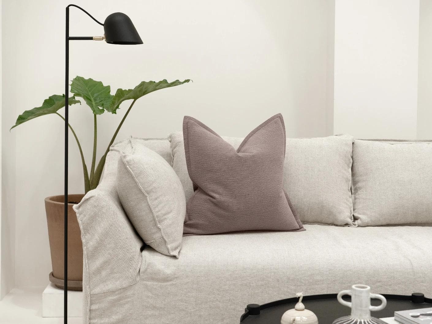 Siena Mauveine cushion in purple and taupe, shown in a lifestyle front view as image 4