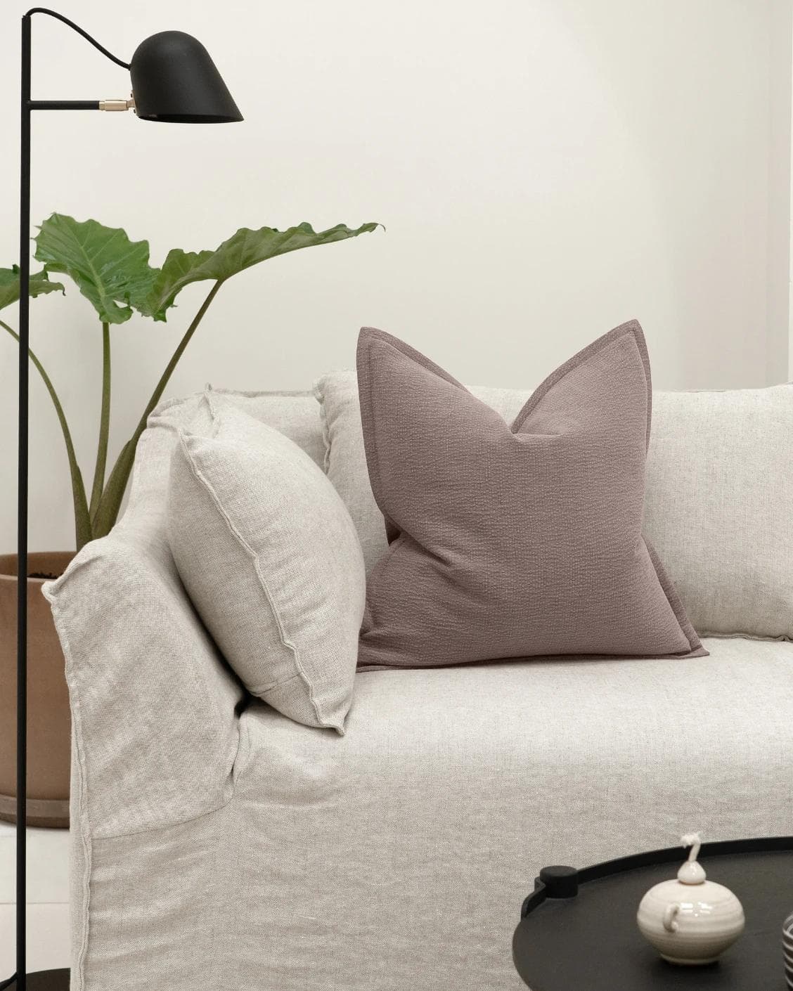 Siena Mauveine cushion in purple and taupe, shown in a lifestyle front view as image 4
