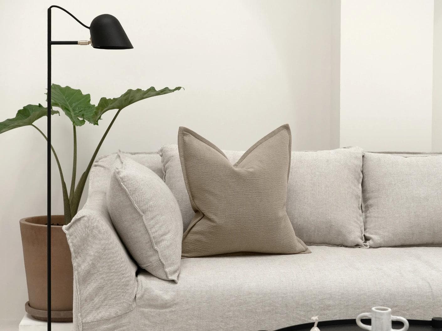 Siena River cushion in grey, shown in a lifestyle front view as image 4