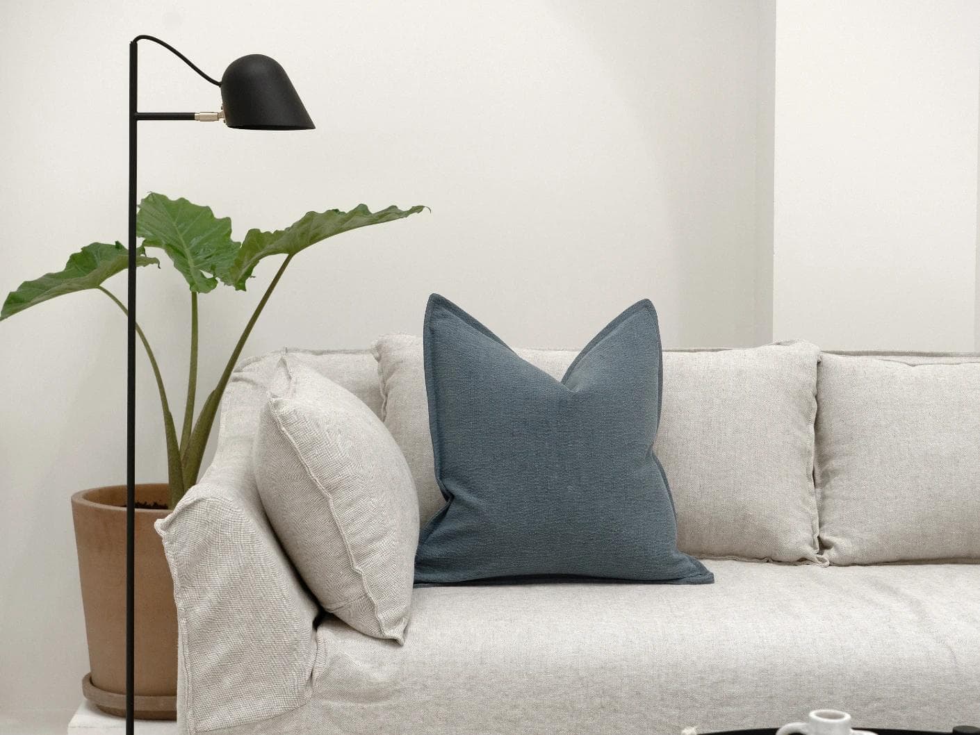 Siena Sky cushion in blue, shown in a lifestyle front view as image 4