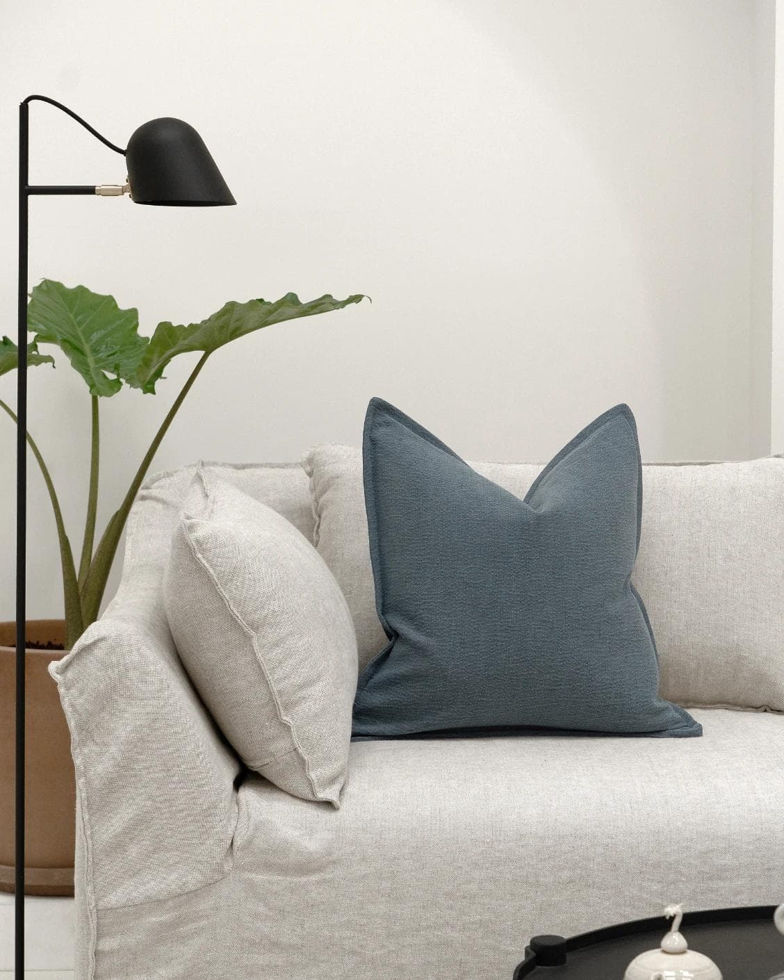 Siena Sky cushion in blue, shown in a lifestyle front view as image 4