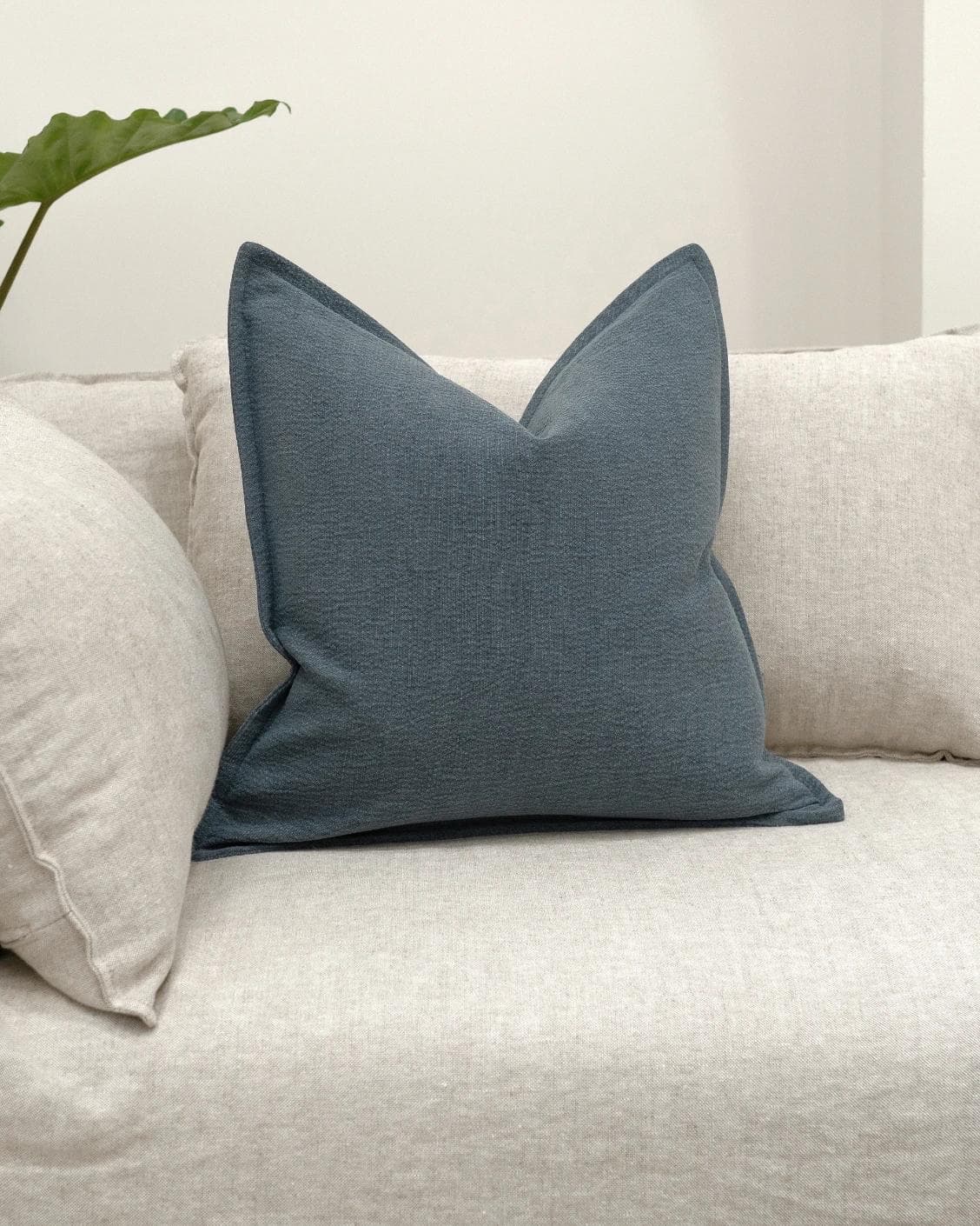 Siena Sky cushion in blue, shown in a lifestyle front view as image 2