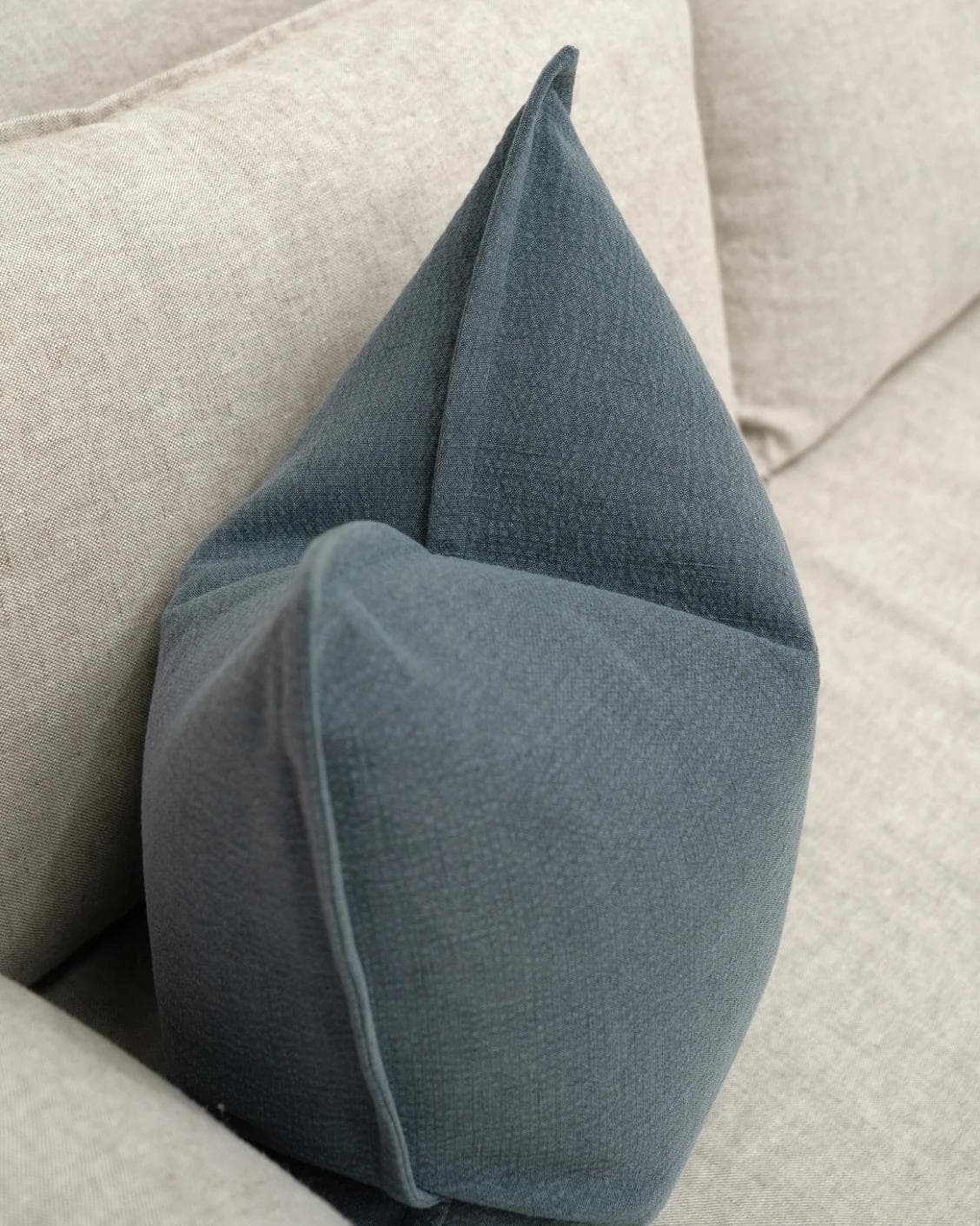 Siena Sky cushion in blue, shown in a lifestyle top view as image 5