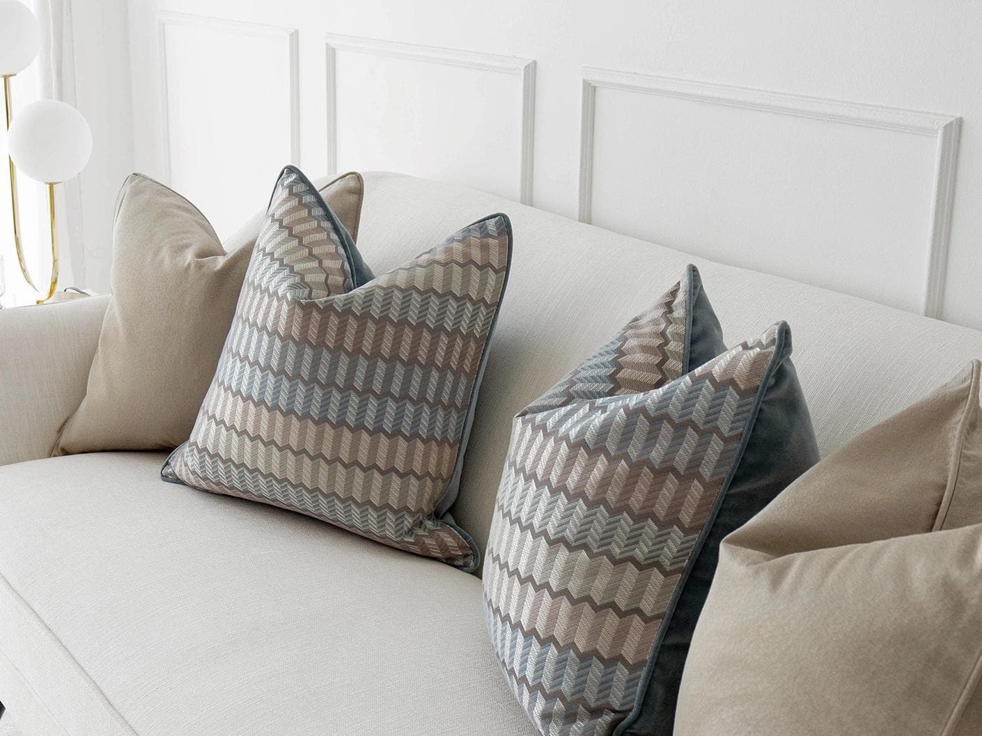 Evie Bundle cushion in silver, blue, gold and beige, shown in a lifestyle right view as image 5