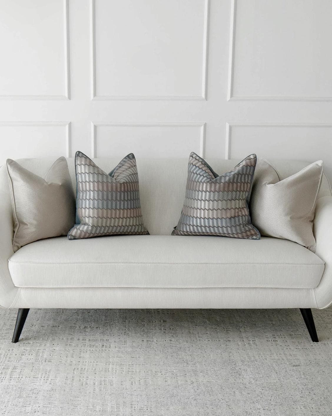 Gina Bundle cushion in silver and blue, shown in a lifestyle front view as image 6