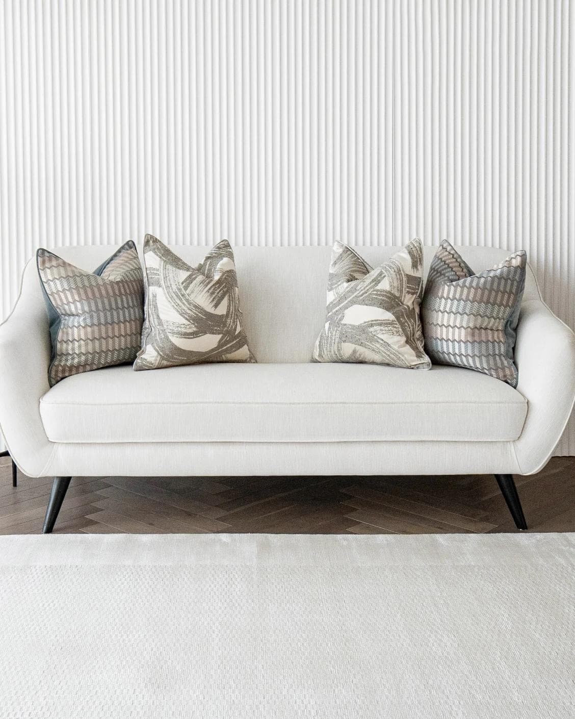 Meadow Bundle cushion in silver, blue, white and grey, shown in a lifestyle front view as image 4