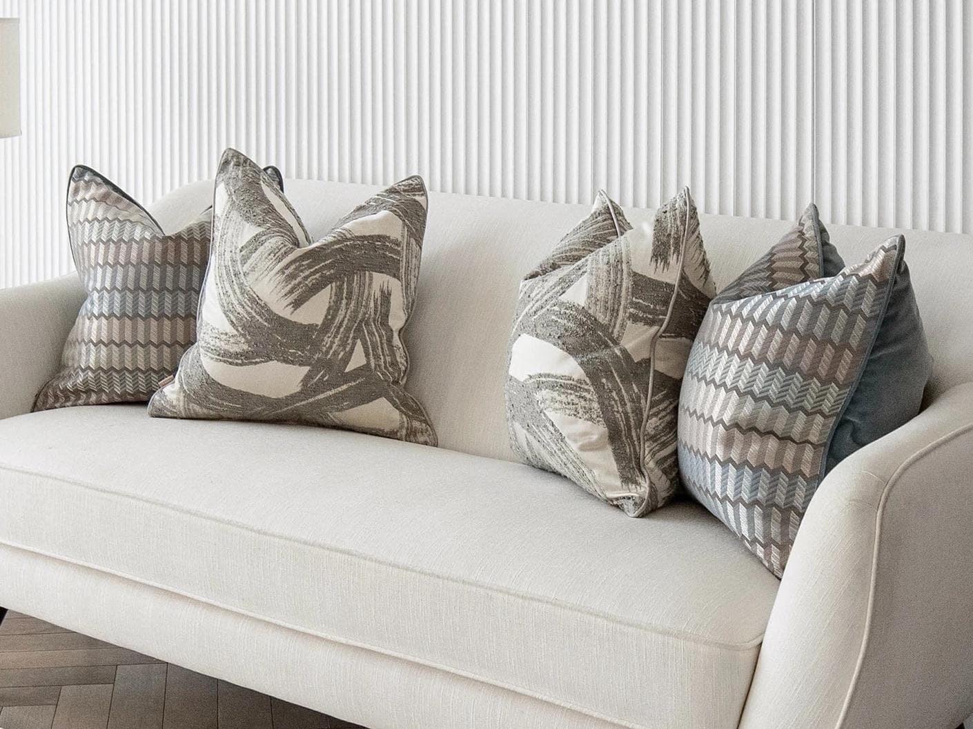 Meadow Bundle cushion in silver, blue, white and grey, shown in a lifestyle right view as image 2