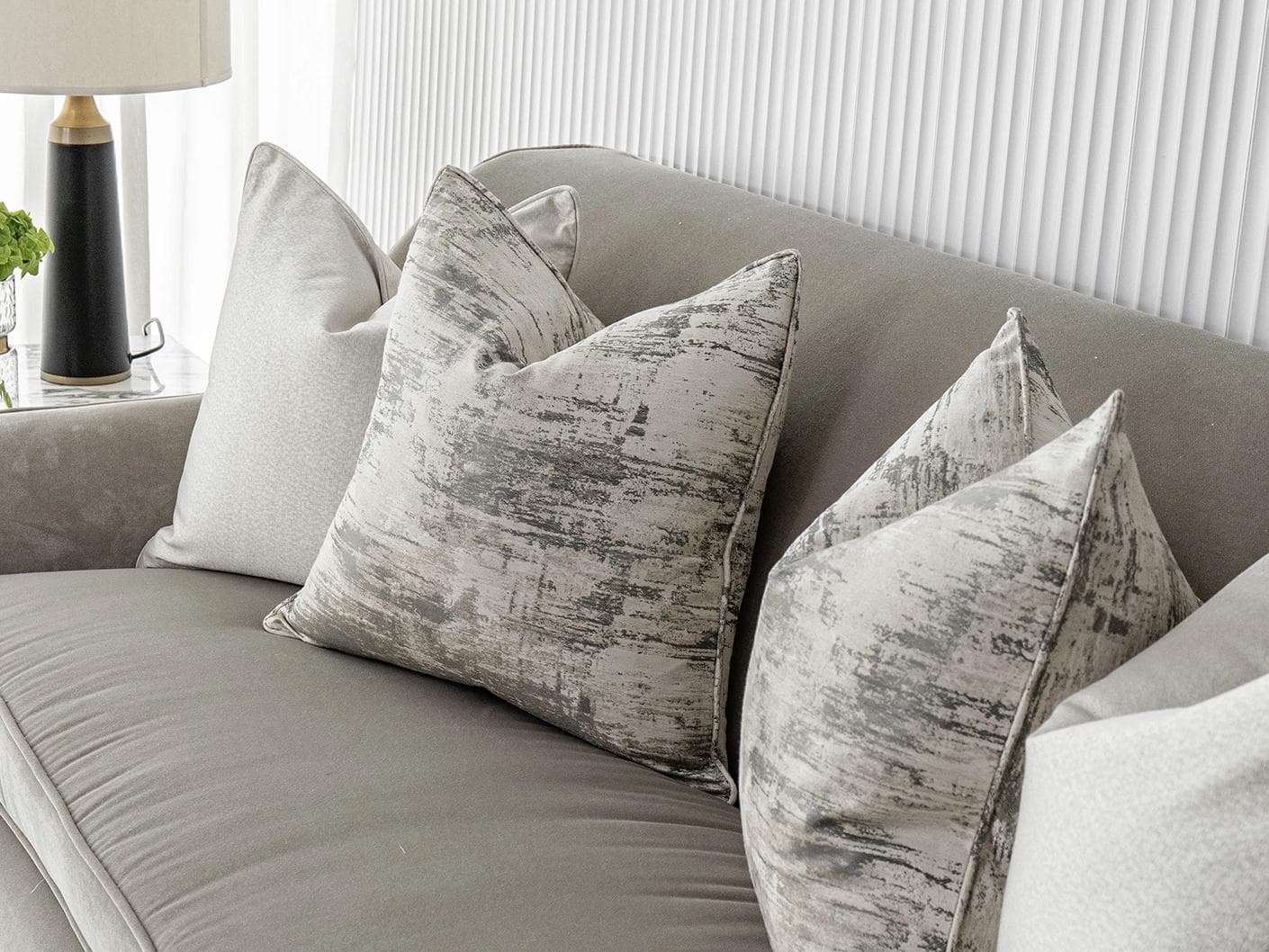 Ivanna Bundle cushion in silver, grey and white, shown in a lifestyle right view as image 5