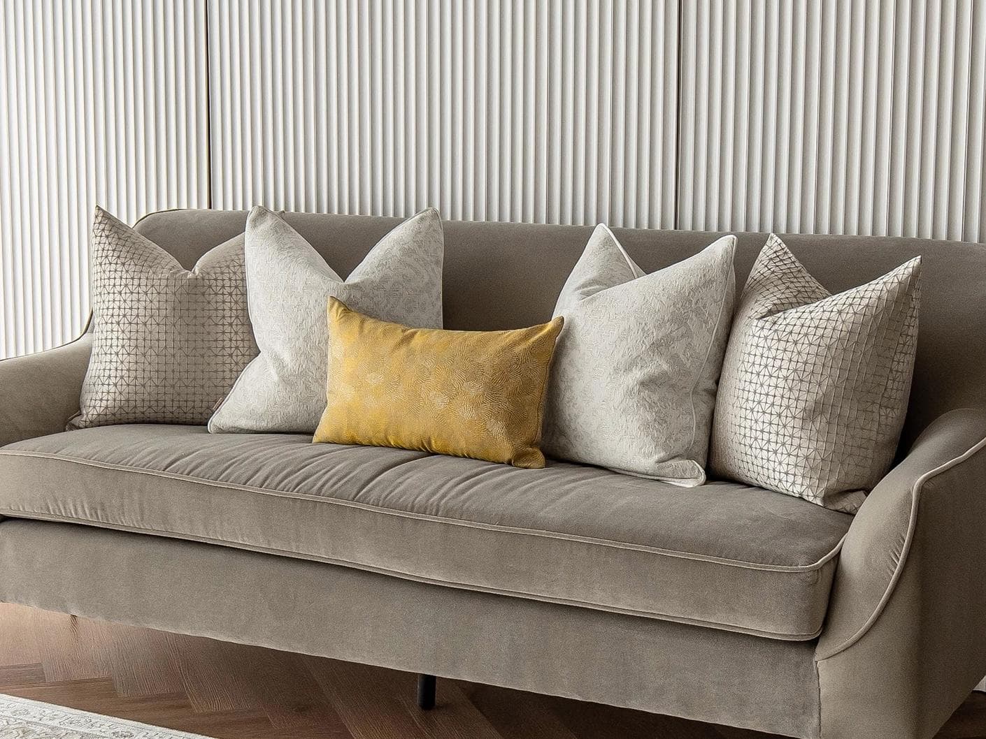 Ray Bundle cushion in silver, white and yellow, shown in a lifestyle right view as image 2