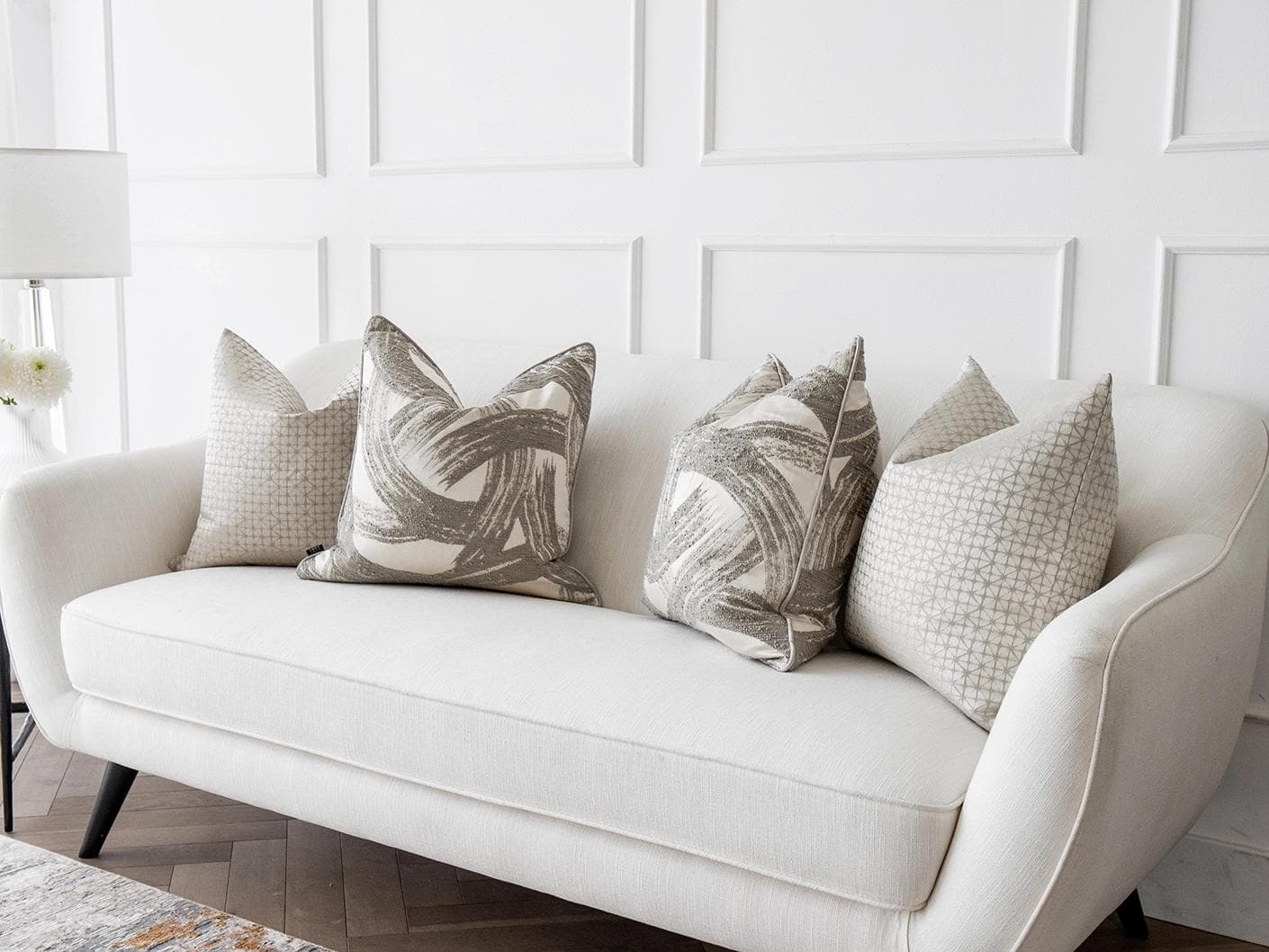 Naya Bundle cushion in silver, white and grey, shown in a lifestyle right view as image 2
