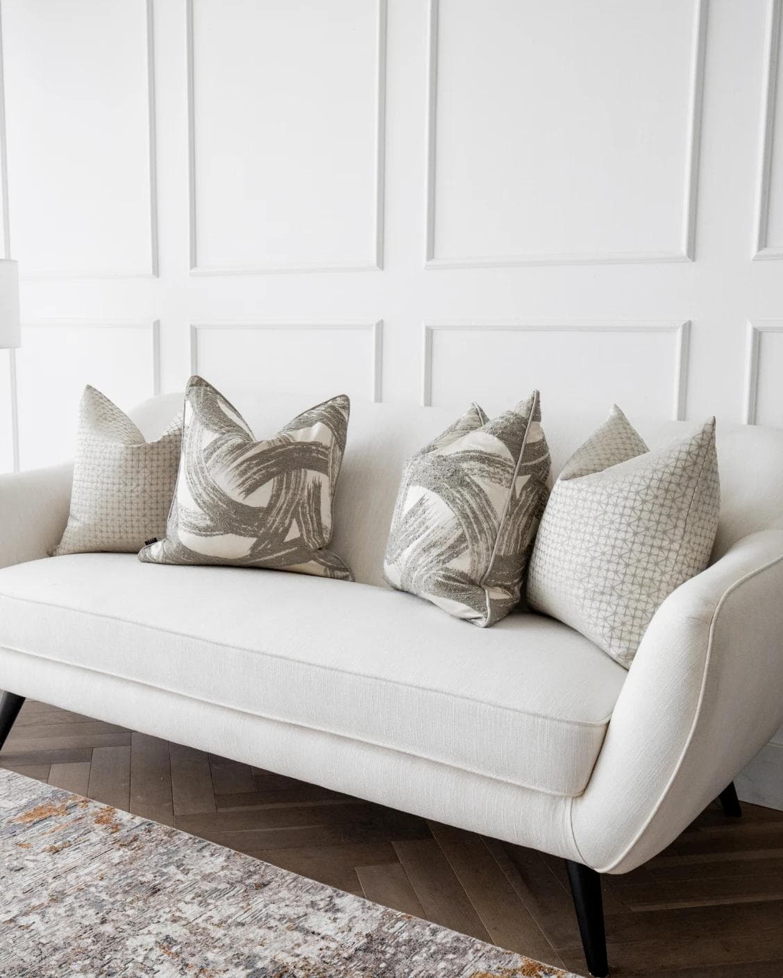 Naya Bundle cushion in silver, white and grey, shown in a lifestyle right view as image 2