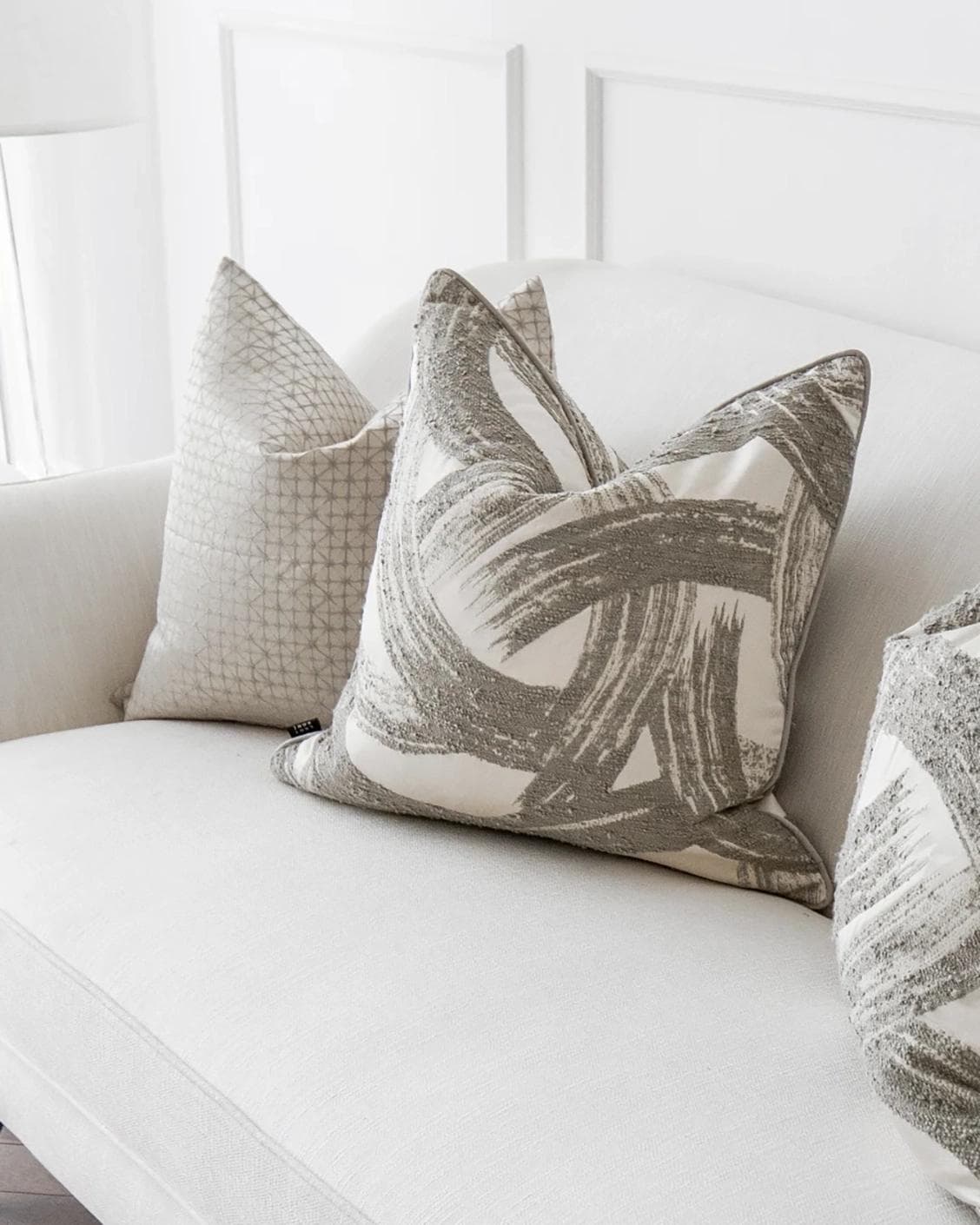 Naya Bundle cushion in silver, white and grey, shown in a product right view as image 5