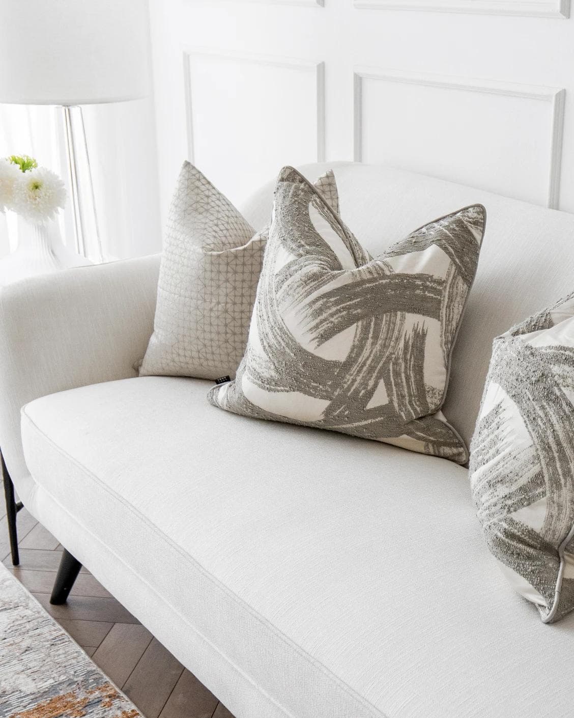Naya Bundle cushion in silver, white and grey, shown in a product right view as image 6