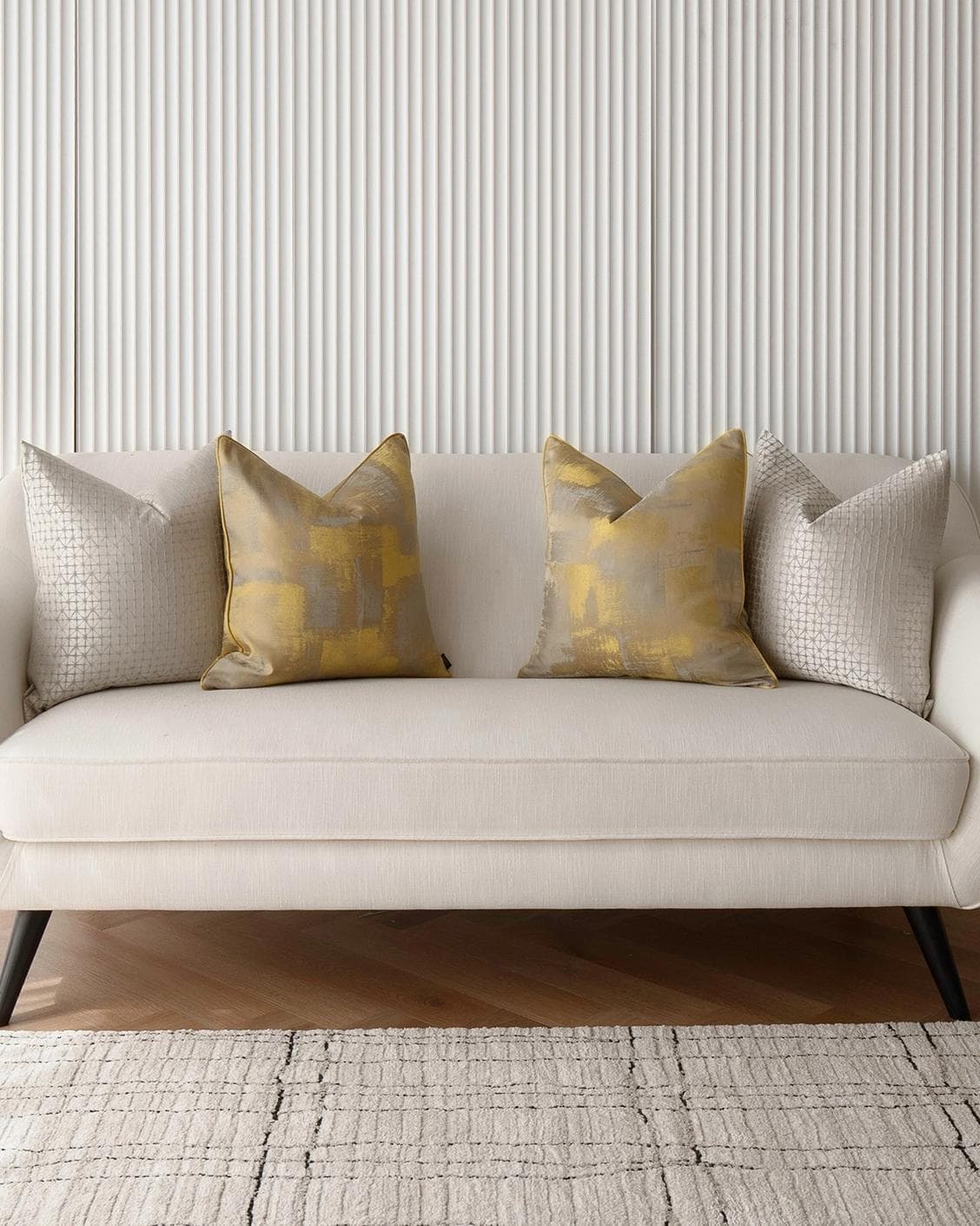 Gustave Bundle cushion in silver and gold, shown in a lifestyle front view as image 4