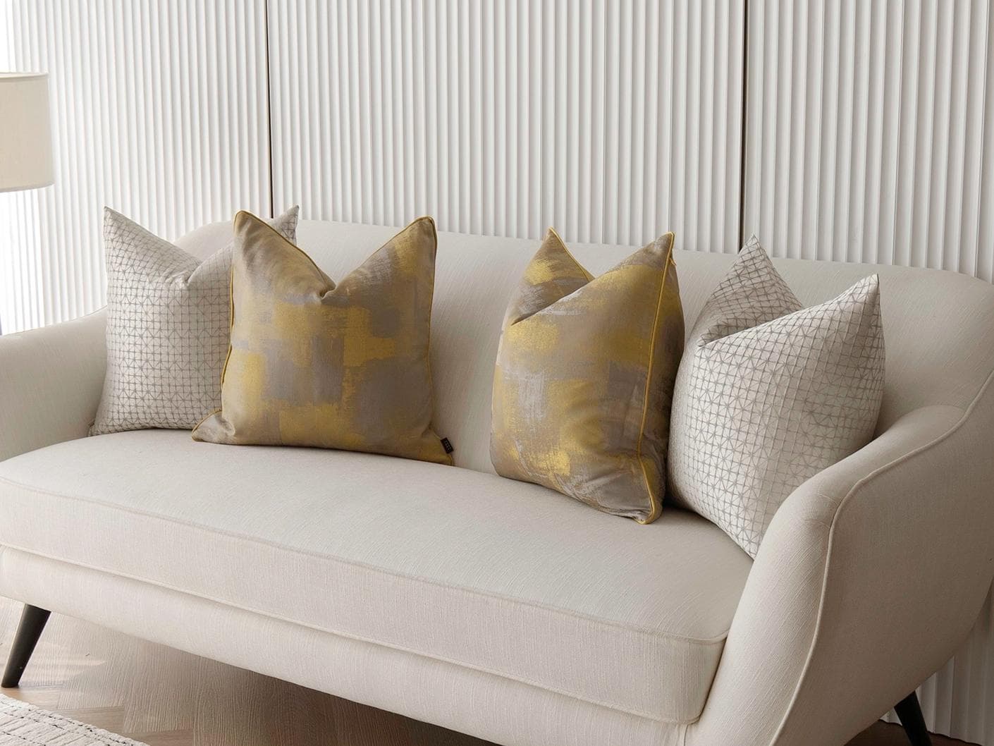 Gustave Bundle cushion in silver and gold, shown in a lifestyle right view as image 2