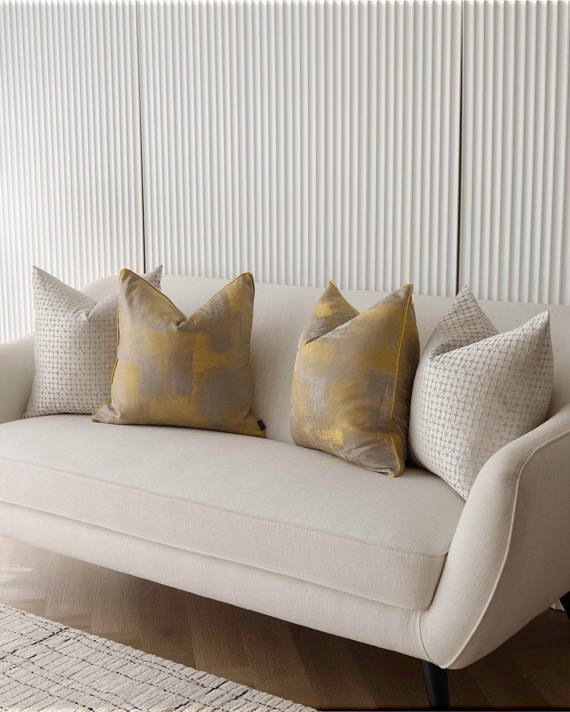 Gustave Bundle cushion in silver and gold, shown in a lifestyle right view as image 2