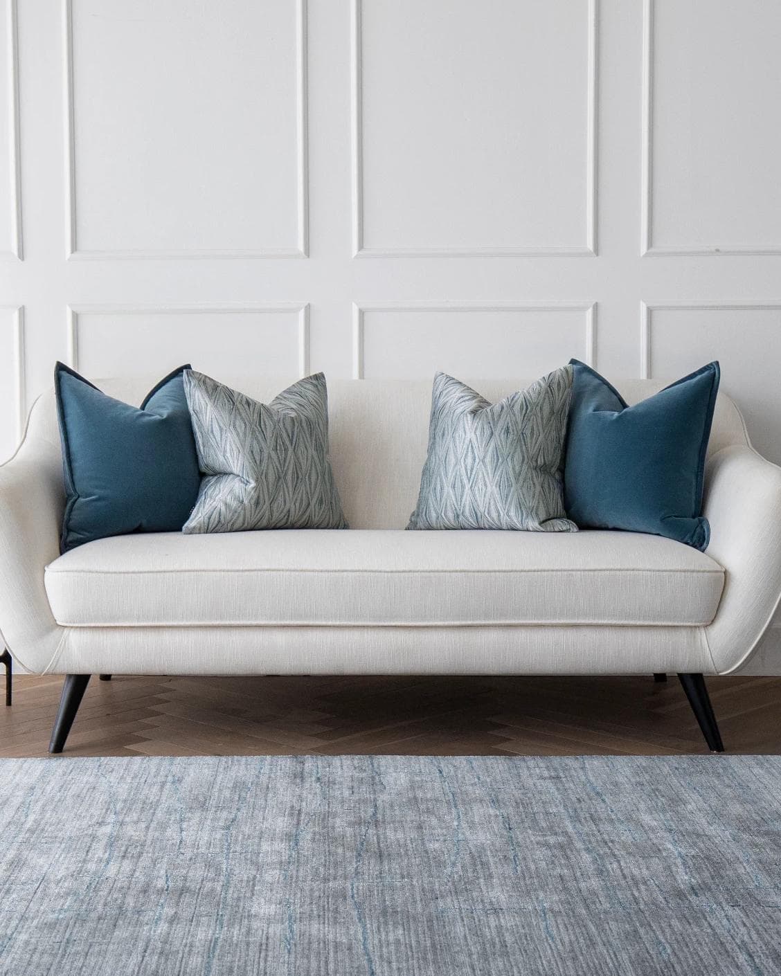 Luke Bundle cushion in silver and blue, shown in a lifestyle front view as image 4
