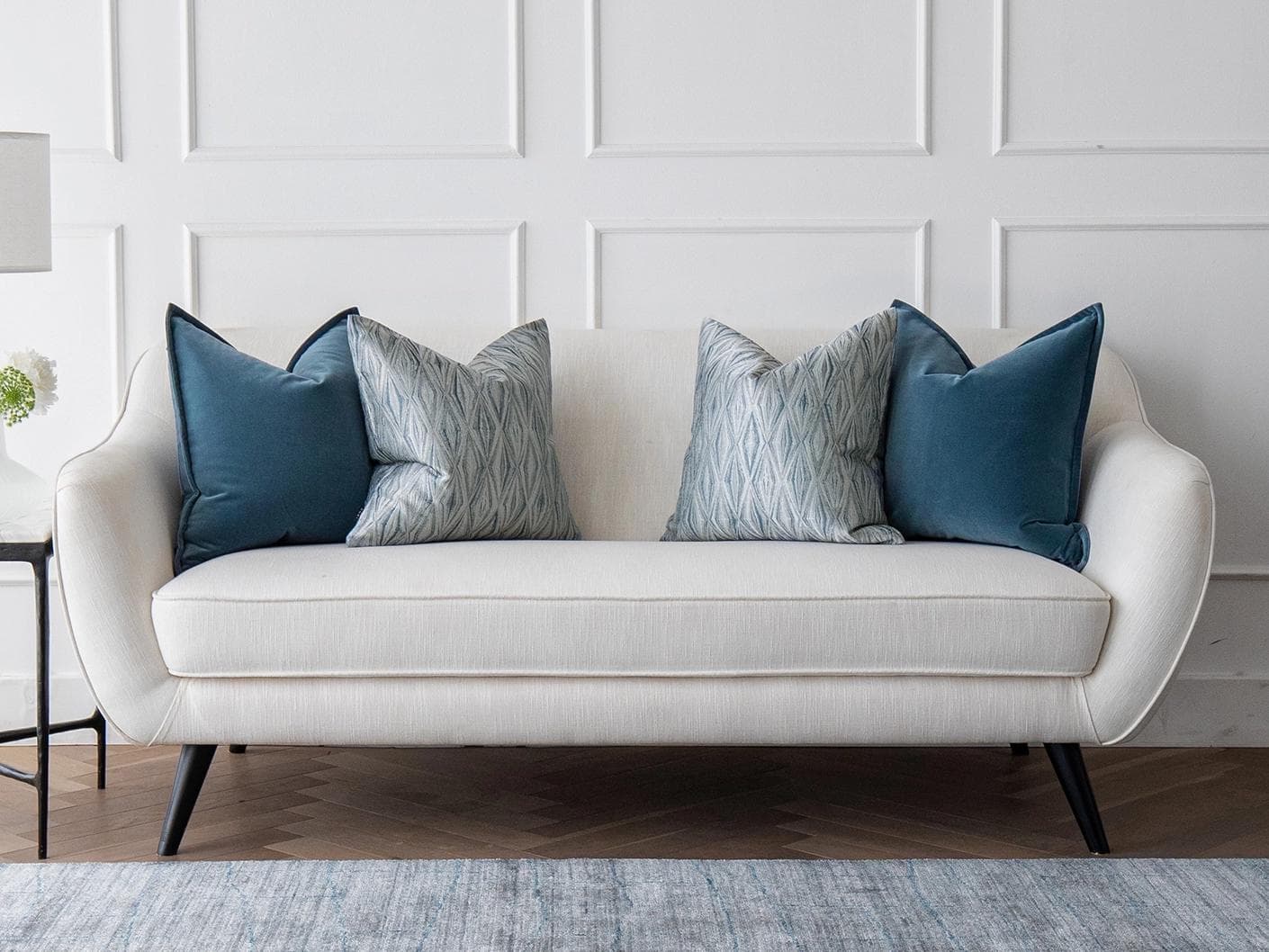 Luke Bundle cushion in silver and blue, shown in a lifestyle front view as image 4