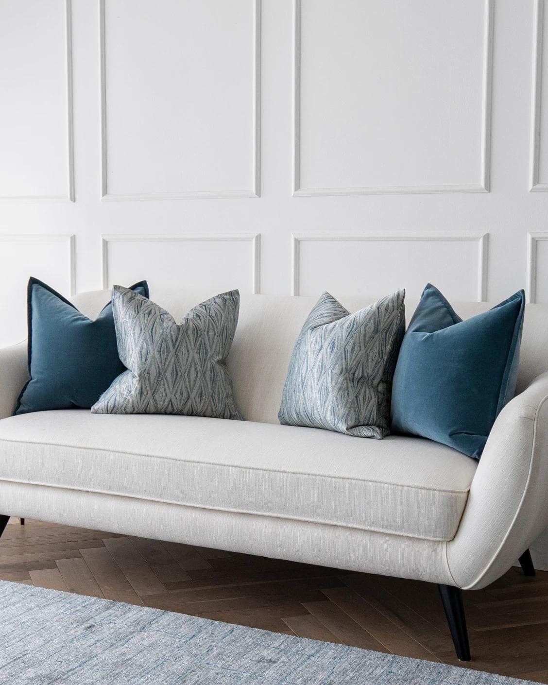 Luke Bundle cushion in silver and blue, shown in a lifestyle right view as image 2