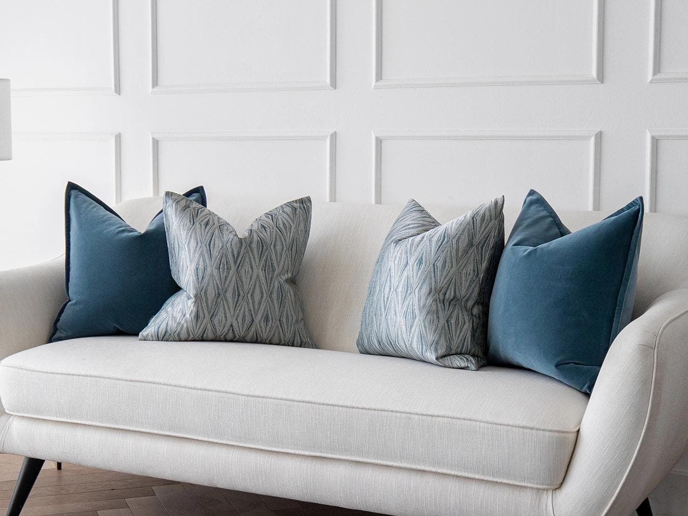 Luke Bundle cushion in silver and blue, shown in a lifestyle right view as image 2