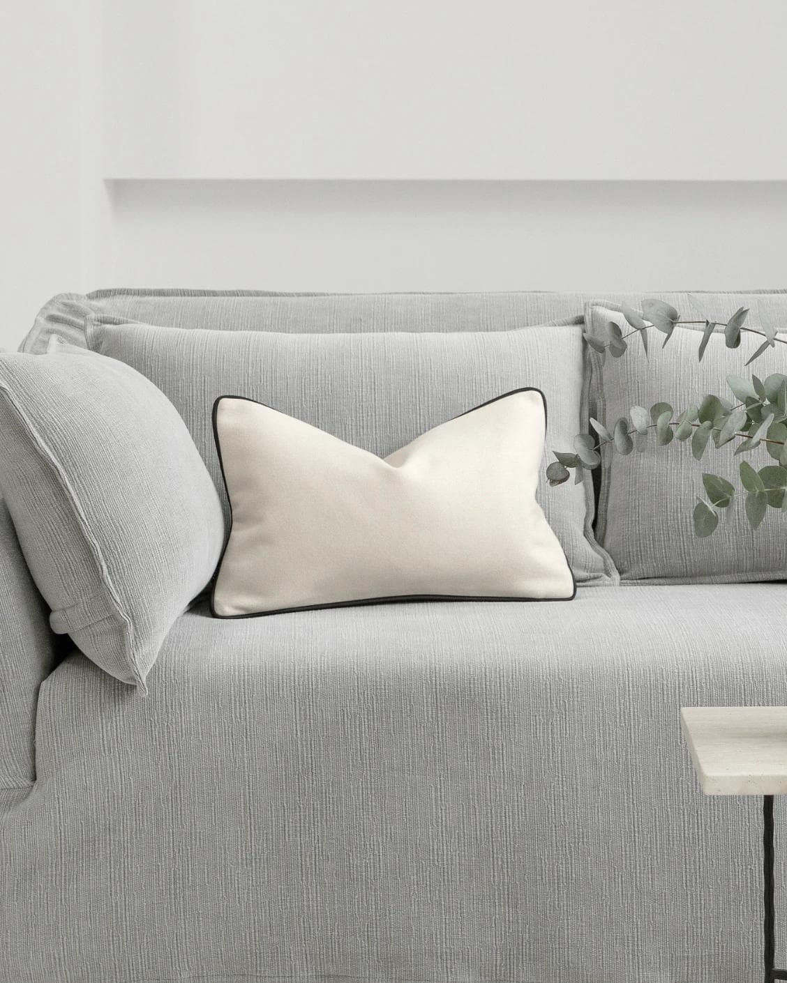 Silvie Bianca II cushion in off white, shown in a lifestyle front view as image 4