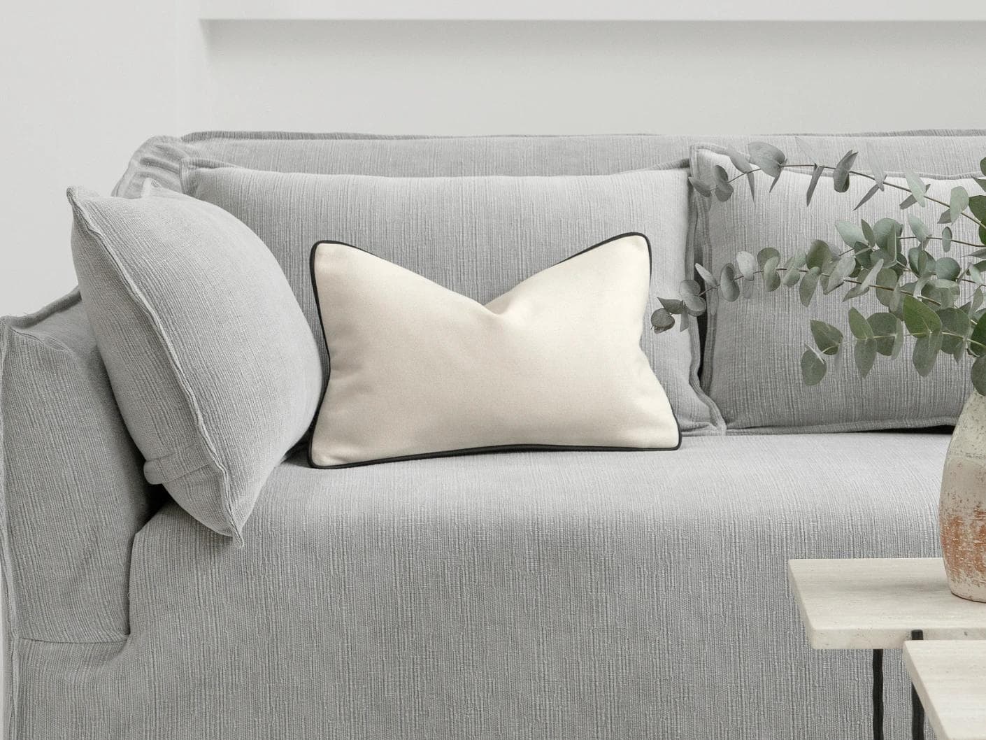 Silvie Bianca II cushion in off white, shown in a lifestyle front view as image 4