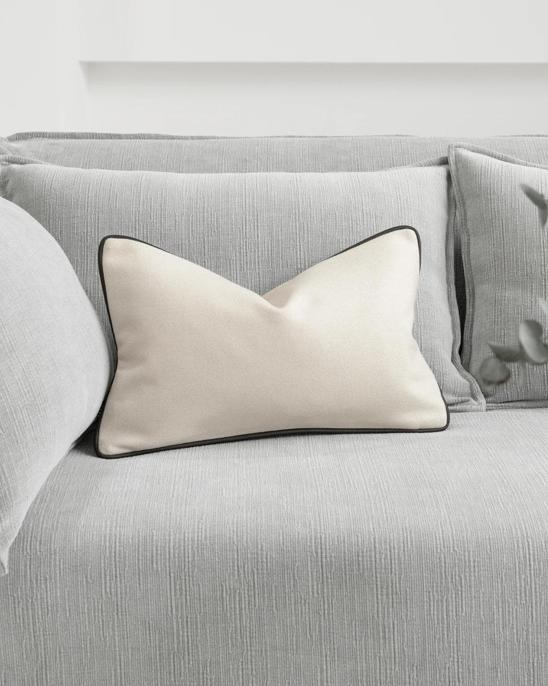 Silvie Bianca II cushion in off white, shown in a lifestyle front view as image 2