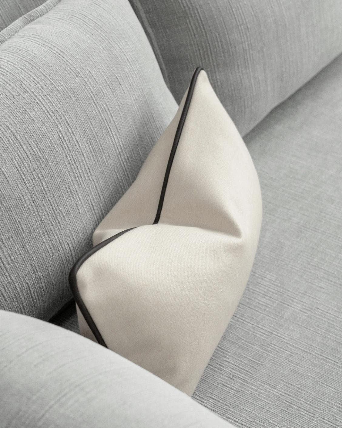Silvie Bianca II cushion in off white, shown in a lifestyle top view as image 5