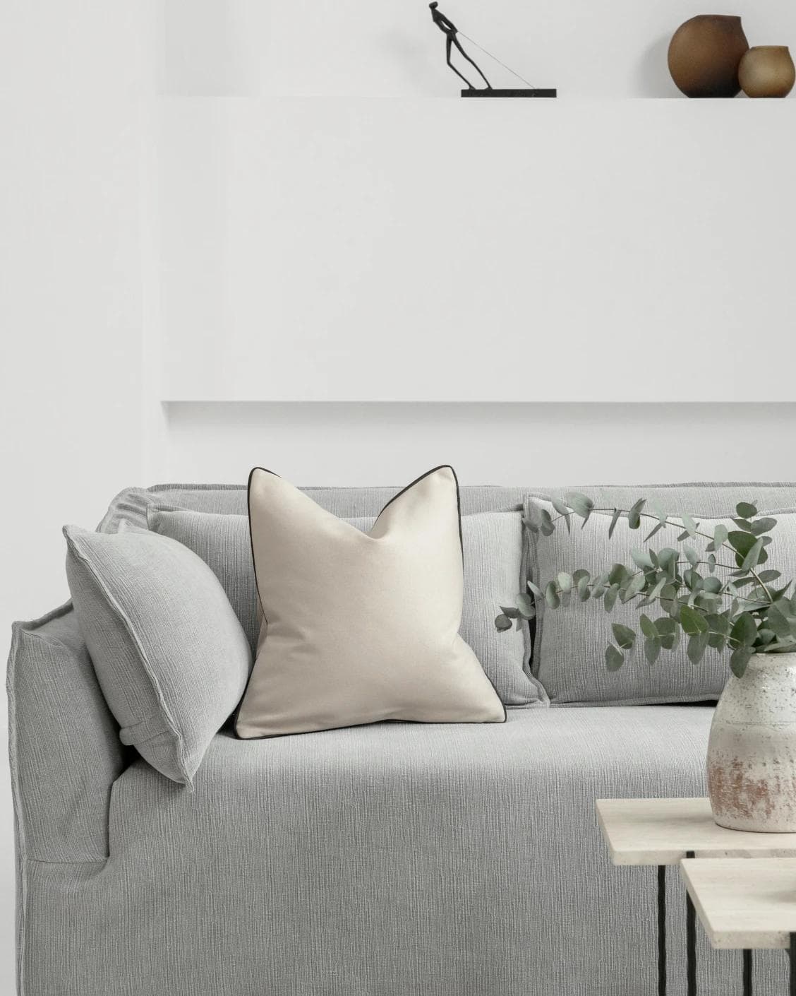 Silvie Bianca cushion in off white, shown in a lifestyle front view as image 4