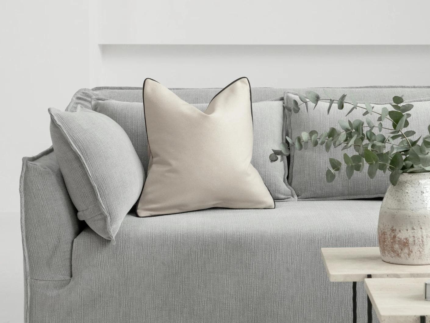 Silvie Bianca cushion in off white, shown in a lifestyle front view as image 4
