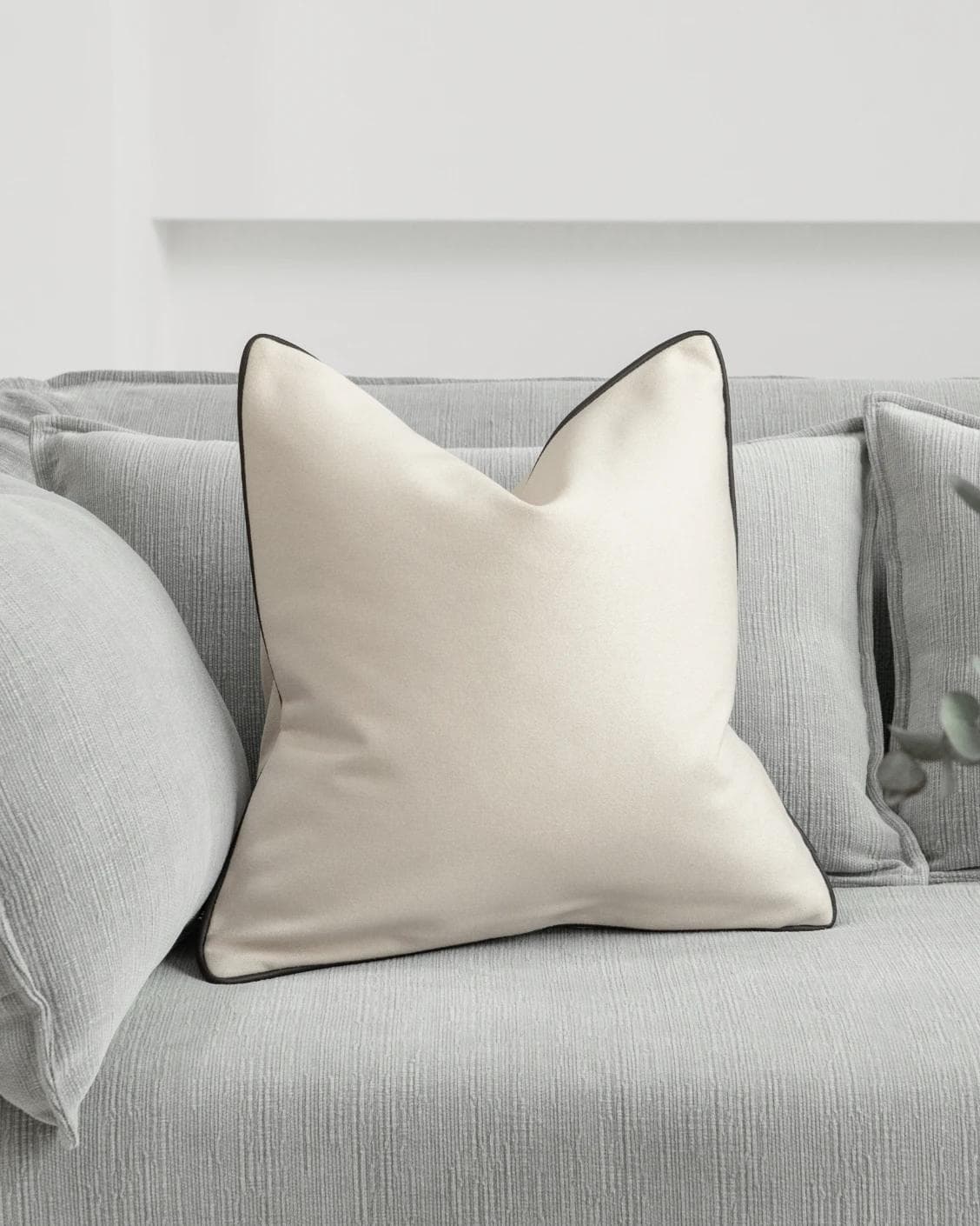 Silvie Bianca cushion in off white, shown in a lifestyle front view as image 2