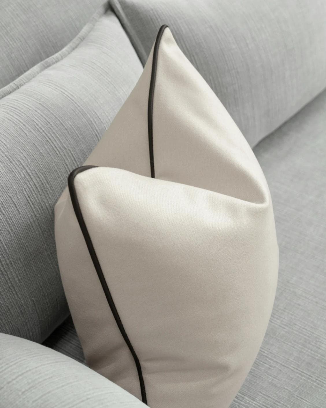 Silvie Bianca cushion in off white, shown in a lifestyle top view as image 5