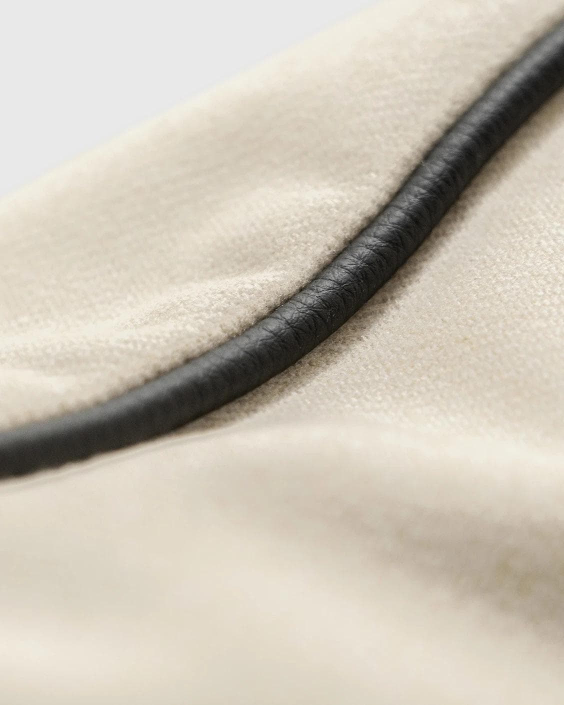 Silvie Bianca cushion in off white, shown in a product close-up as image 6