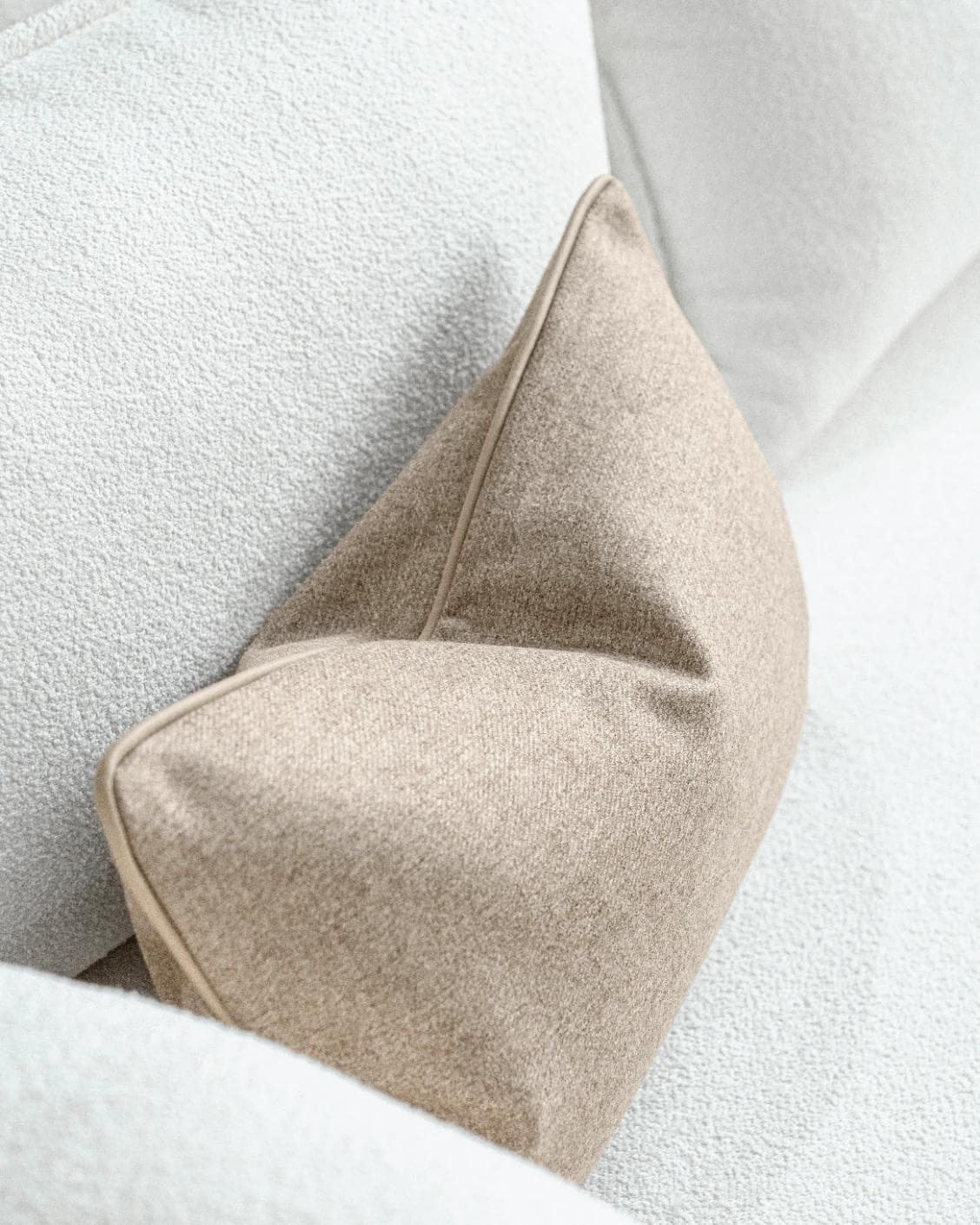 Silvie Laurent II cushion in taupe, shown in a lifestyle top view as image 5